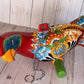Mexican Talavera Ceramic. Hanging Parrot Red Background Classic Puebla
