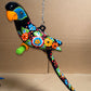 Hanging Ceramic Parrot: Mexican Folk Art, Floral Pattern, Cobalt Blue Background