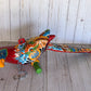 Mexican Talavera Ceramic. Hanging Parrot Red Background Classic Puebla